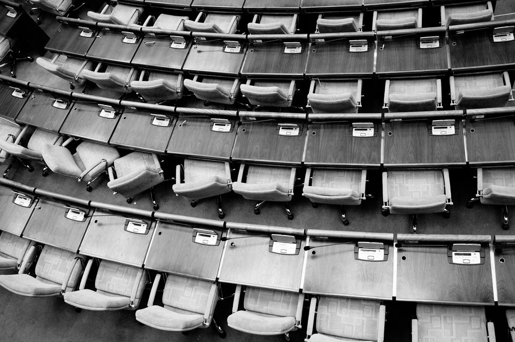 Empty seats in a legislative chamber